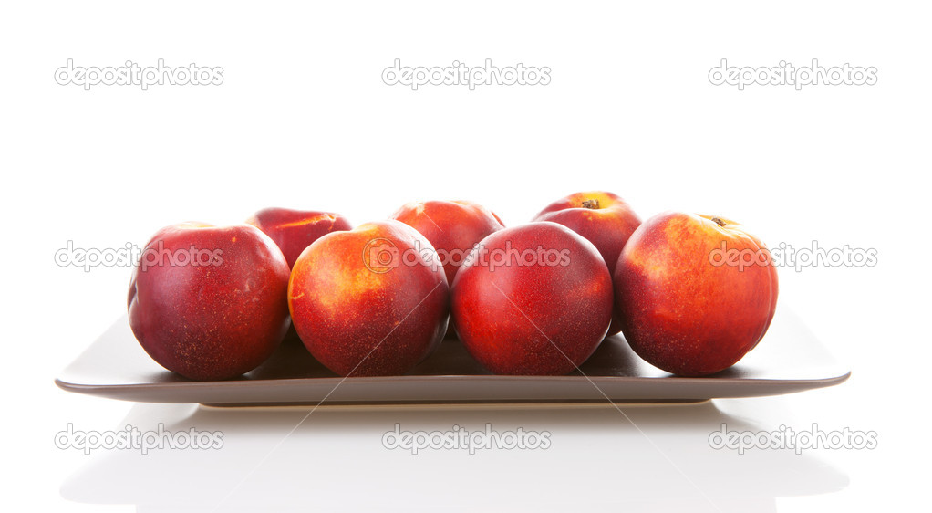 Plate with fresh nectarines