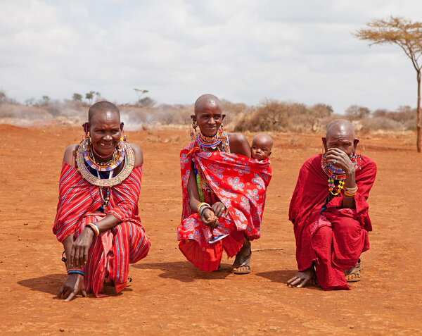 AFRICA, KENYA, MASAI MARA - JULY 2: Female tribal members wearin