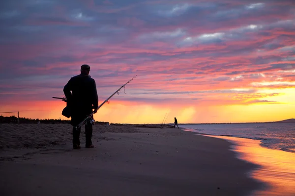 Silhouette sopra pescatore — Foto Stock