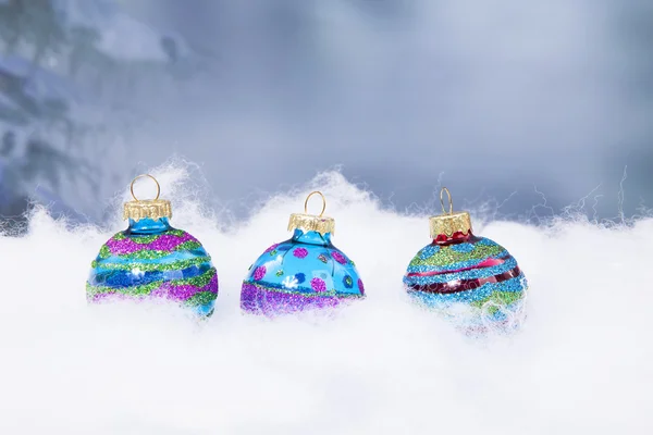 Three Christmas balls in a row — Stock Photo, Image