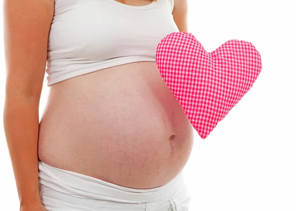 Pregnant belly with checkered heart — Stock Photo, Image