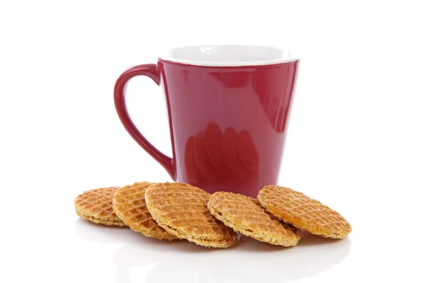 Pile of typical Dutch stroopwafels ( with syrup) near coffee cup — Stock Photo, Image