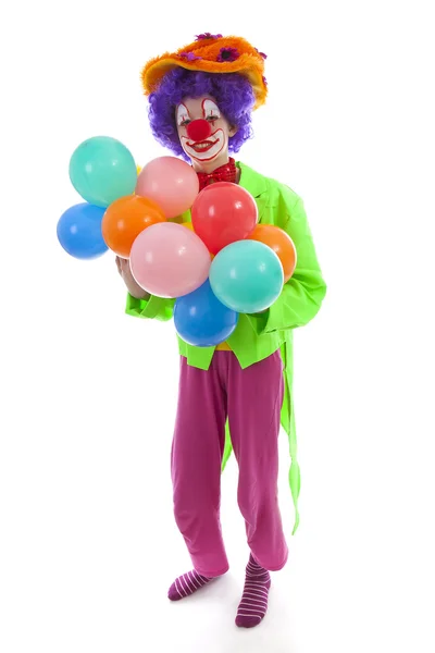 Dítě oblečený jako barevné legrační klaun s balónky — Stock fotografie