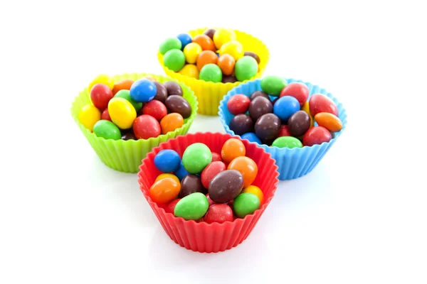 Tassen mit bunten Bonbons — Stockfoto