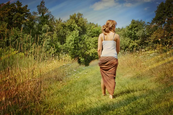 Young woman walking away — Stock Photo, Image