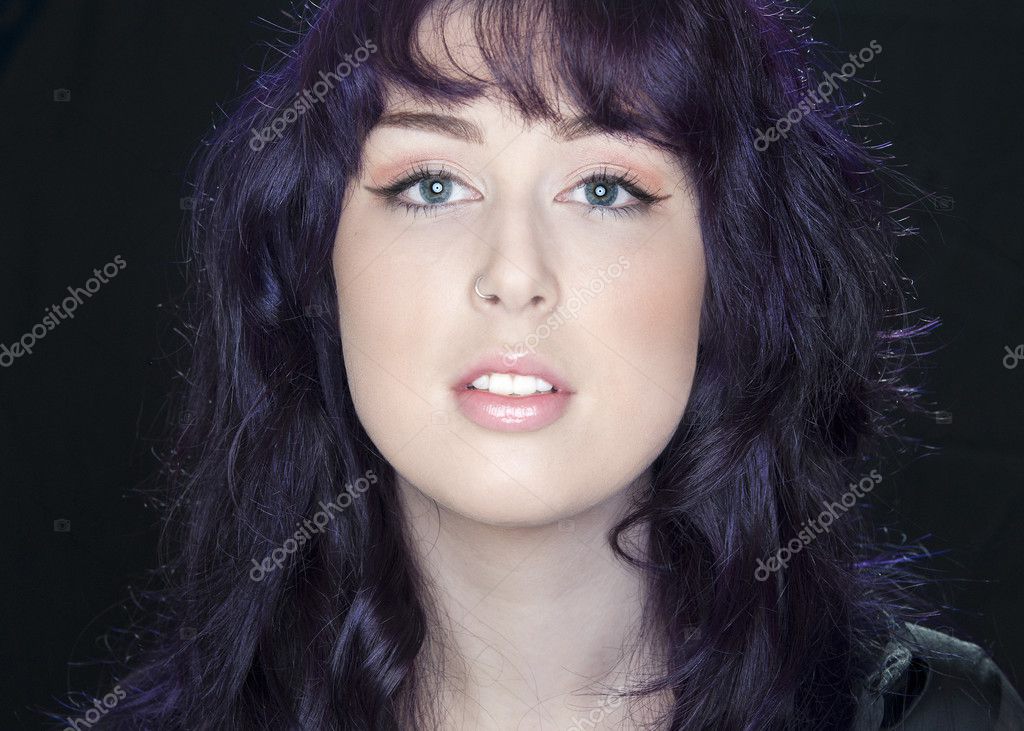 Portrait Of A Beautiful Young Woman With Purple Hair Stock