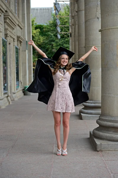 A university graduate in robes — Stock Photo, Image