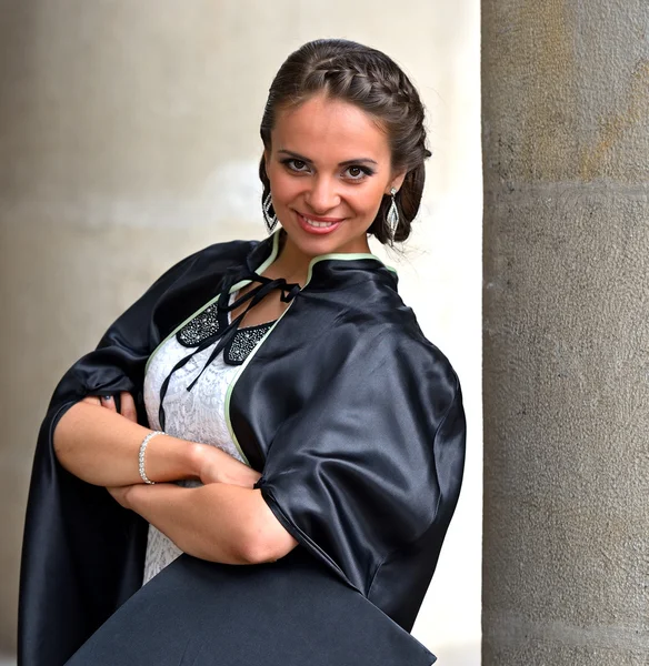 Um graduado universitário em roupões — Fotografia de Stock