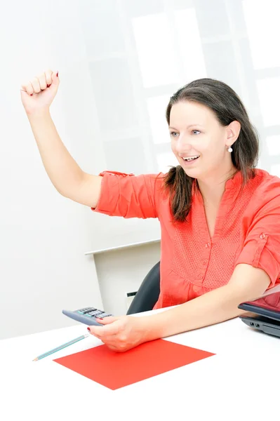 Real attractive businesswoman celebrating success in her office — Stock Photo, Image