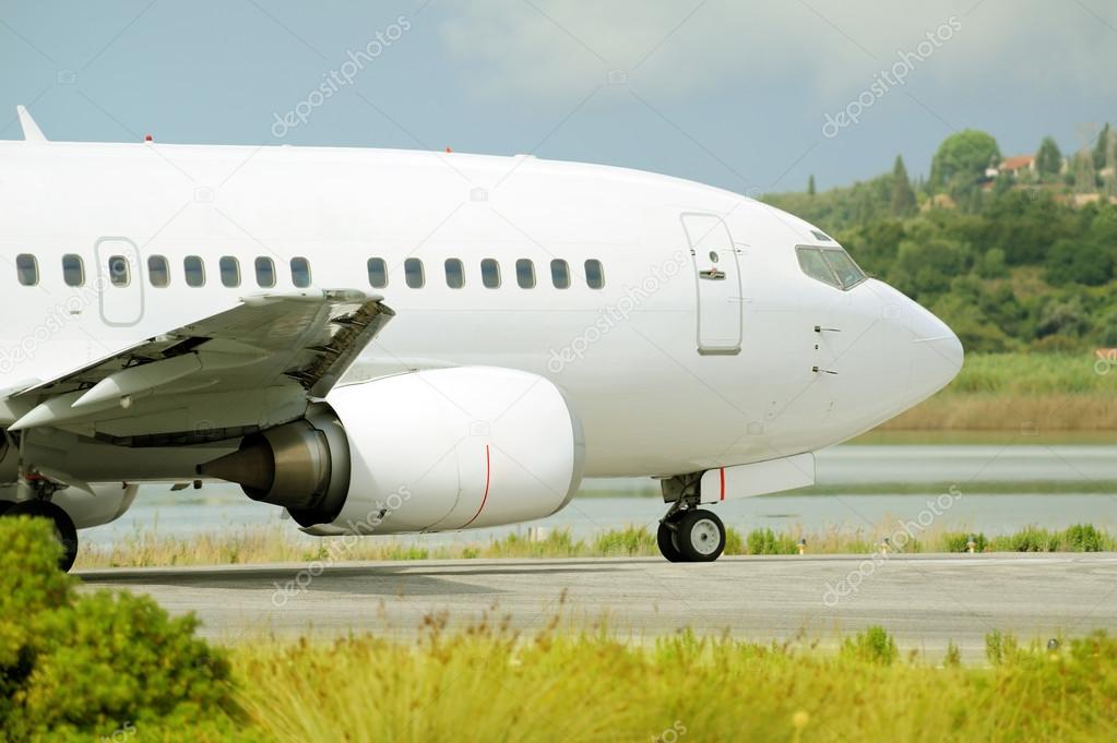 Passenger airplane waiting for takeoff clearance on the runway
