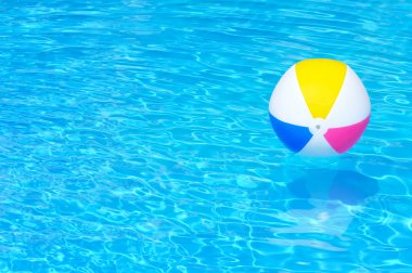 Inflatable ball in swimming pool clipart