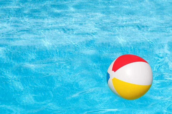 Inflatable ball in swimming pool — Stock Photo, Image