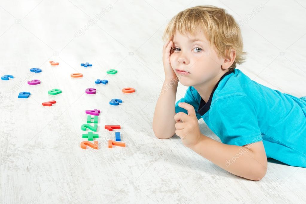 Child studying mathematics. Stock Photo by ©inarik 14169633