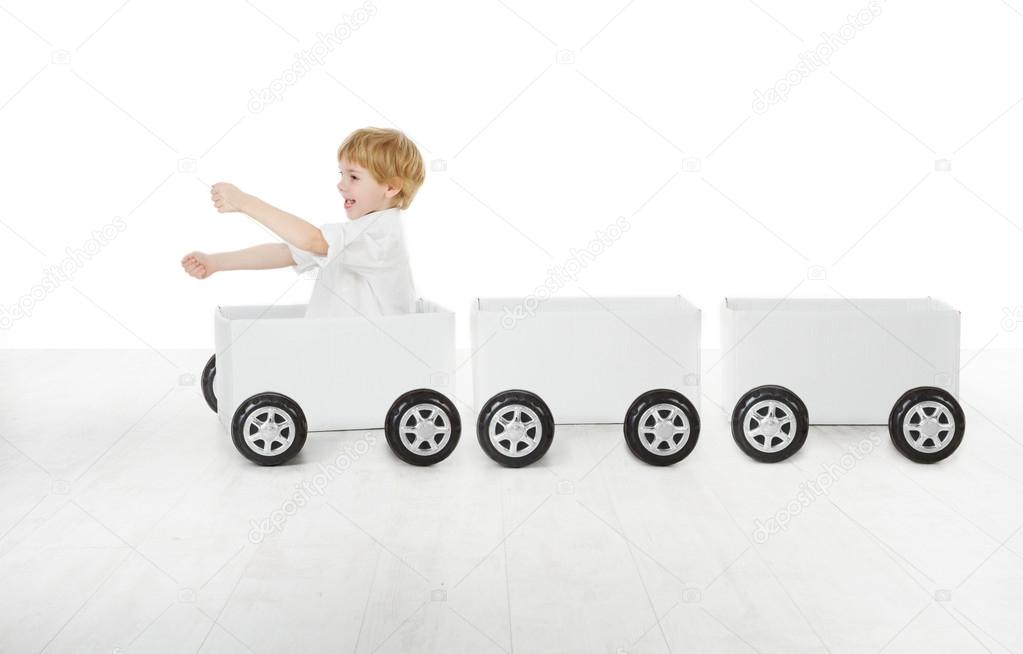 Child driving box car and empty wagons