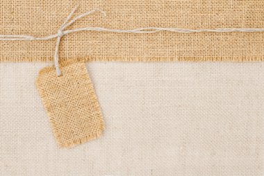 Sackcloth tag pricing over burlap texture