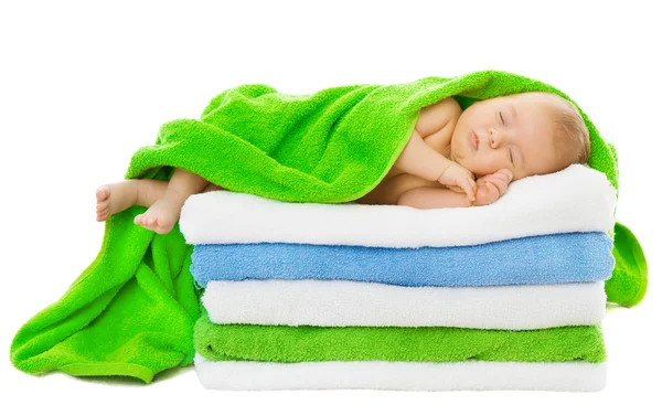 Baby newborn sleeping wrapped in bath towels — Stock Photo, Image