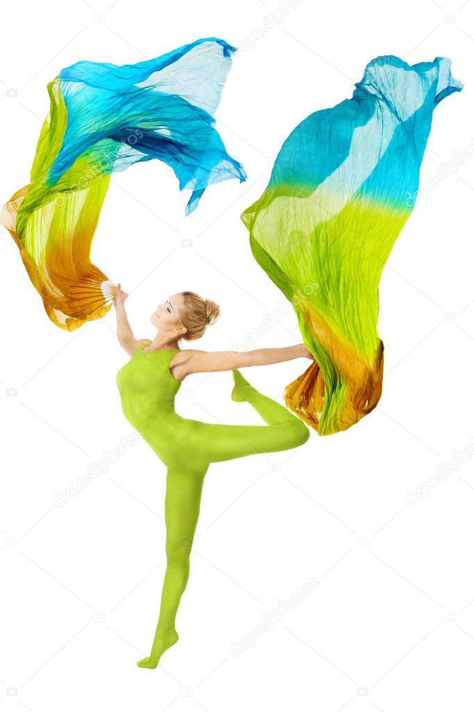 Woman dancing with flutterin flying colorful fabric over white