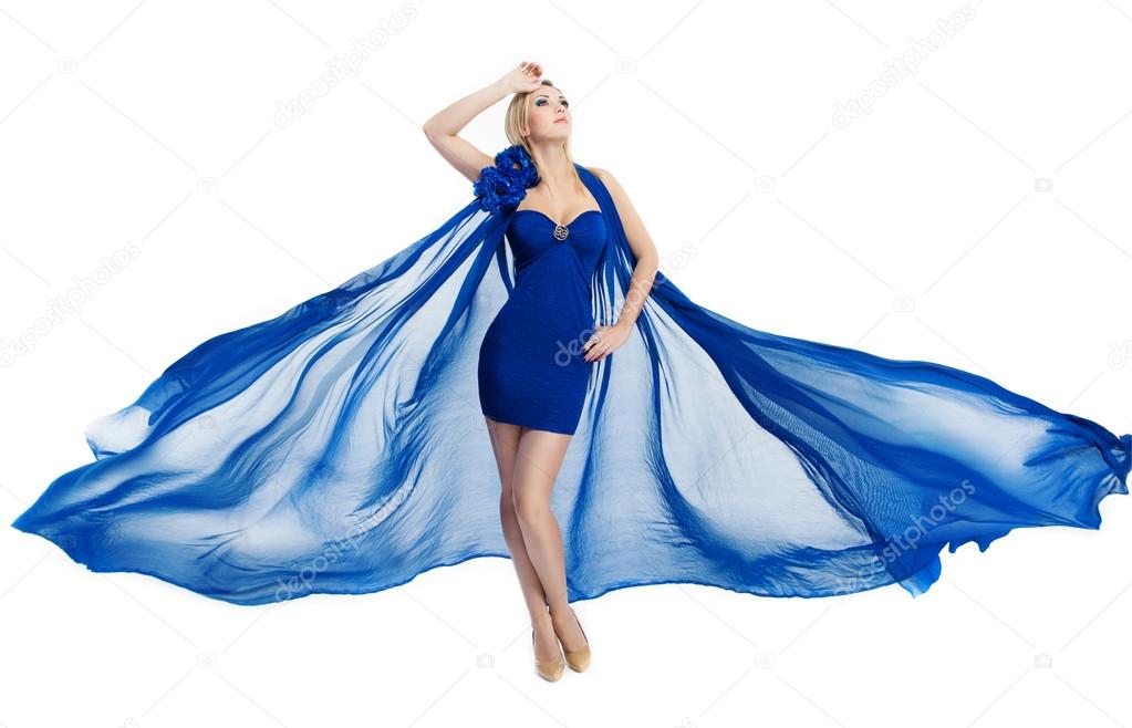 Woman in blue fluttering dress waving on wind over white