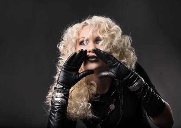 Woman hands around mouth, loud talking speaking, blonde curly hair in black gloves, hands to mouth — Stock Photo, Image