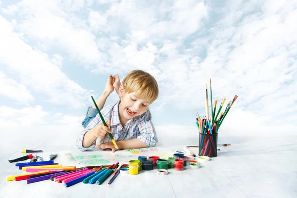 Child painting with color brush using a lot of drawing tools. Creative kid artist. Creativity and inspiration concept. — Stock Photo, Image