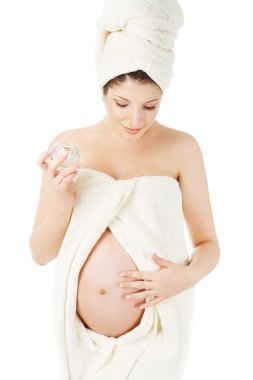 hamile kadın spa havluları, gebelik göbek, Sağlık Cilt Bakımı ve güzellik, beyaz arka plan üzerinde izole için krem