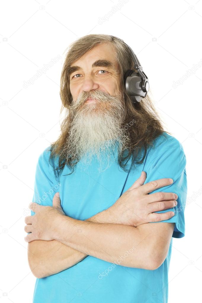 Senior man listening to music in headphones. Old man with beard, elder isolated white background