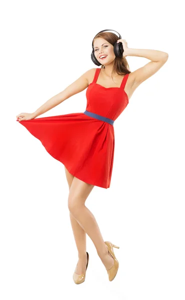 Nő headpnones táncol, hallgató-hoz zene. Elszigetelt fehér háttér felett piros ruhás lány — Stock Fotó