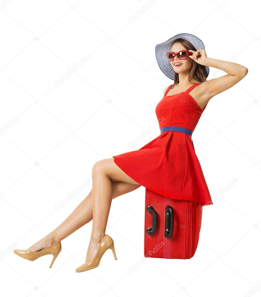 Woman in red on vacation suitcase. Summer holiday travel. White background.