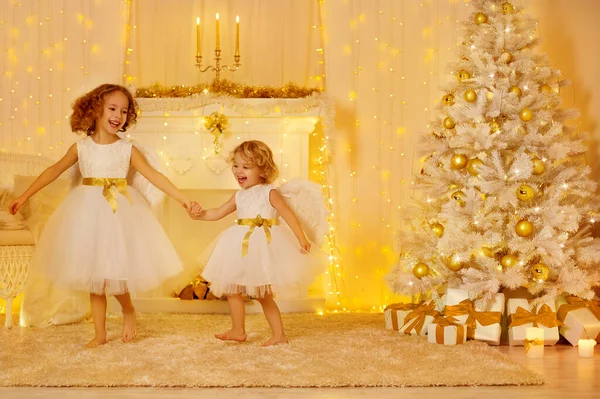 Happy Little Girls Playing Next Christmas Tree Gifts White Home — Stock Photo, Image