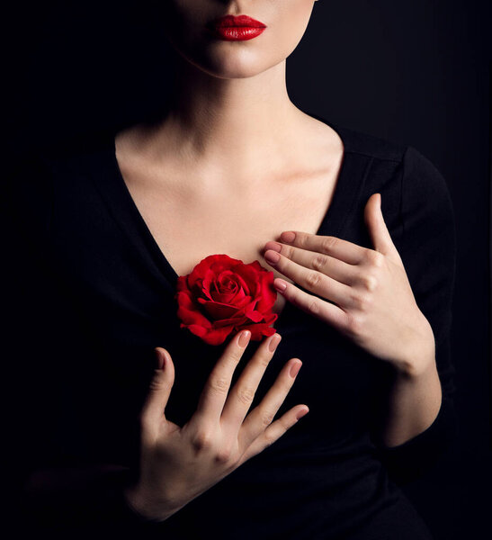 Woman with Rose Flower and Red Lips Make up over Black. Elegant Lady Fantasy Fine Art Close up Portrait. Beauty Model Body and Hands Cosmetic Care