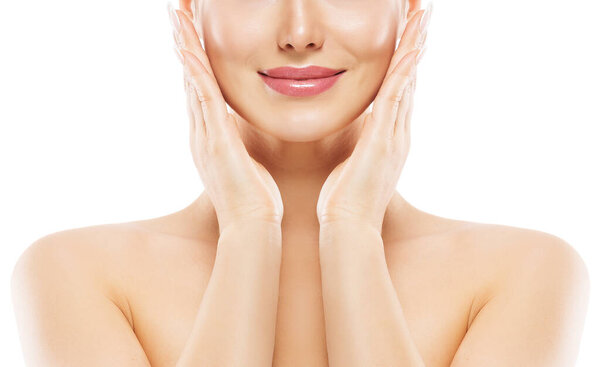 Woman Lips Close up. Beauty Model Smooth Skin Care. Smiling Girl Massaging Face Cheeks. Hands with Nude Nail Polish applying Facial Cream over White Isolated