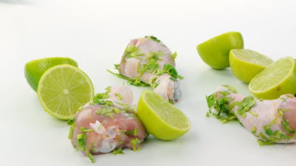 Chicken meat with halfs of lime and herbs — Stock Video