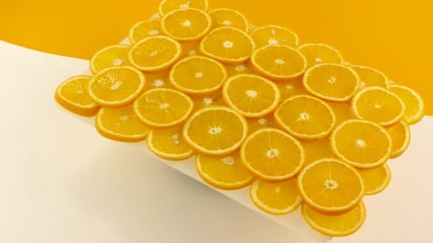 Les oranges coupées en tranches se rapprochent. Boucle sans couture . — Video