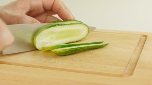 Man cutting cucumbers — Stock Video