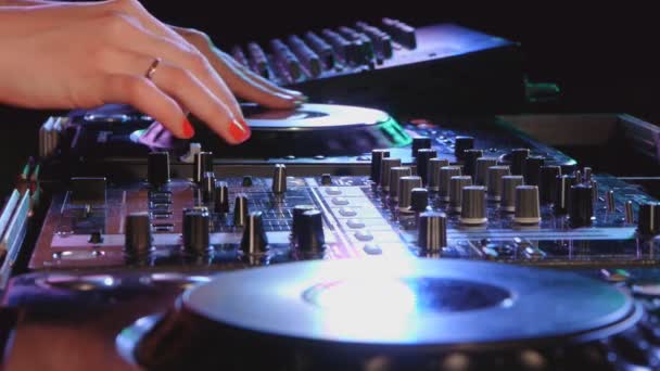 Female dj mixes the track at a party — Stock Video