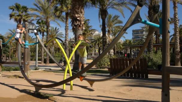 Boy playing on the playground — Stock Video