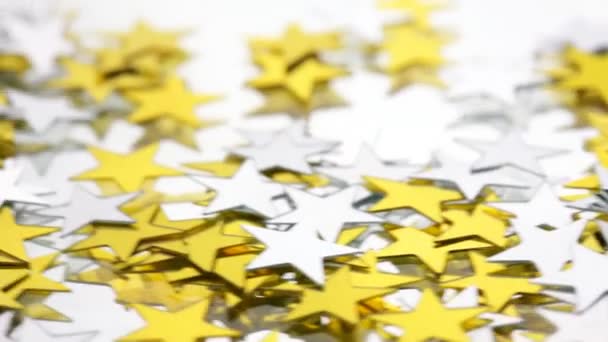 Silver and Gold confetti stars on a white background — Stock Video