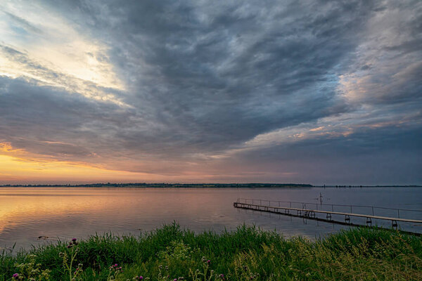 A view of faro island at sunset as veiwed from stubbekoping in Denmark.