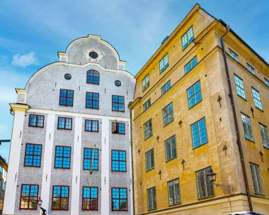 STOCKHOLM, SWEDEN - JULY 31, 2022: This cobblestone plaza dating back to the Middle Ages has colorful historic buildings