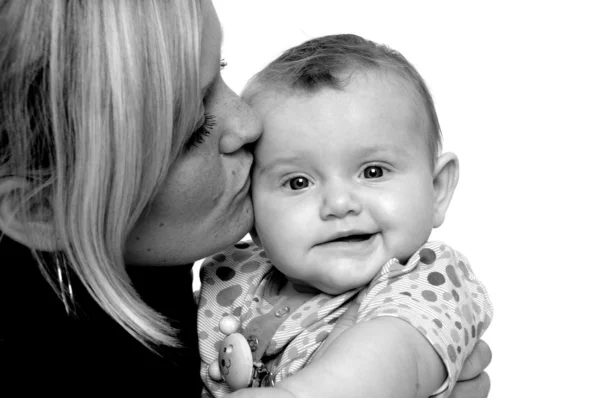 Mother is kissing baby — Stock Photo, Image