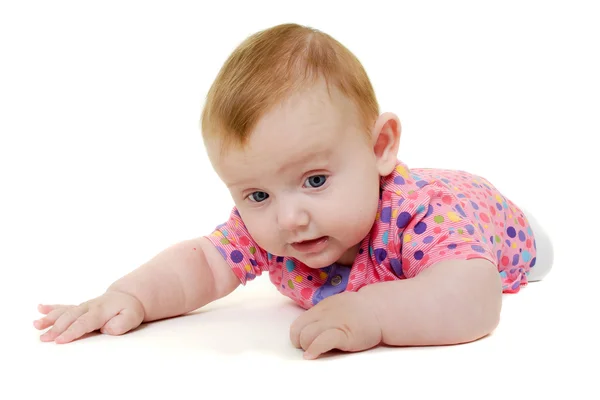 Baby spelar på vit bakgrund. — Stockfoto