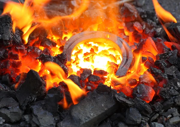 Horseshoe in embers — Stock Photo, Image