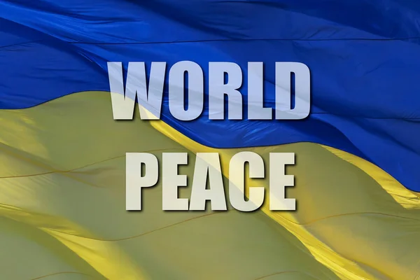 Σύνθημα Παγκόσμια Ειρήνη Στην Κυματιστή Ουκρανική Εθνική Σημαία — Φωτογραφία Αρχείου