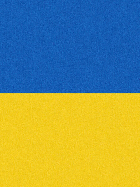 Stand with Ukraine backdrop: Ukrainian flag painted on cardboard paper
