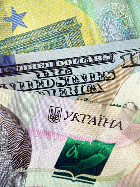 currency exchange: close up of Ukrainian hryvnia, euro and USD banknotes