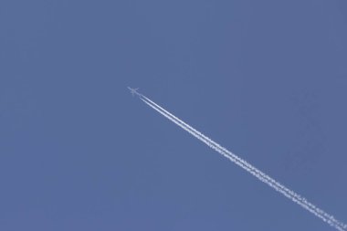 view on aircraft flying in a clear blue sky