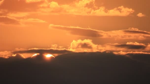 East side bright sun disk through dark night clouds — Stock Video