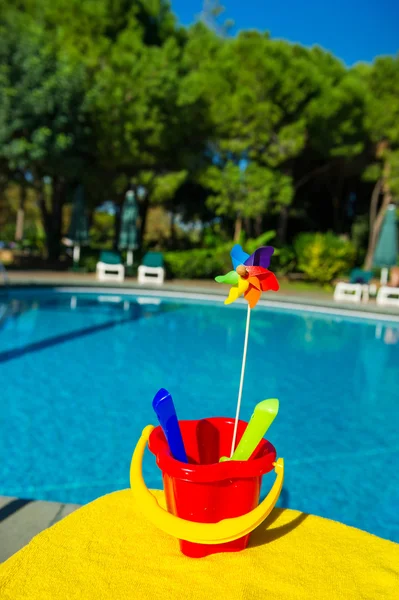 Plastic toys near swimming pool