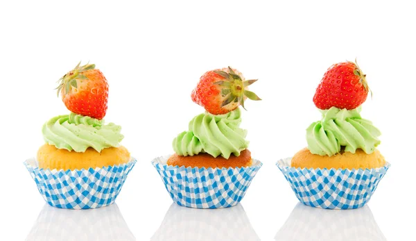 Blue and green cupcakes with strawberries — Stock Photo, Image