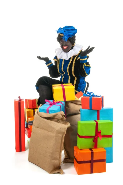 Dutch black pete with many presents — Stock Photo, Image